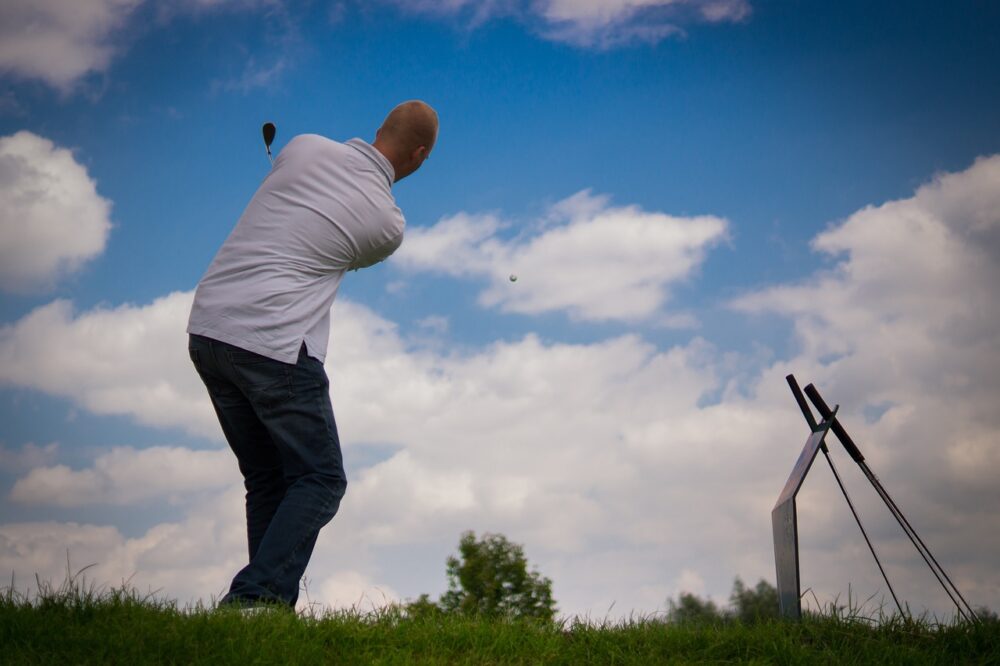 man-practicing-golf