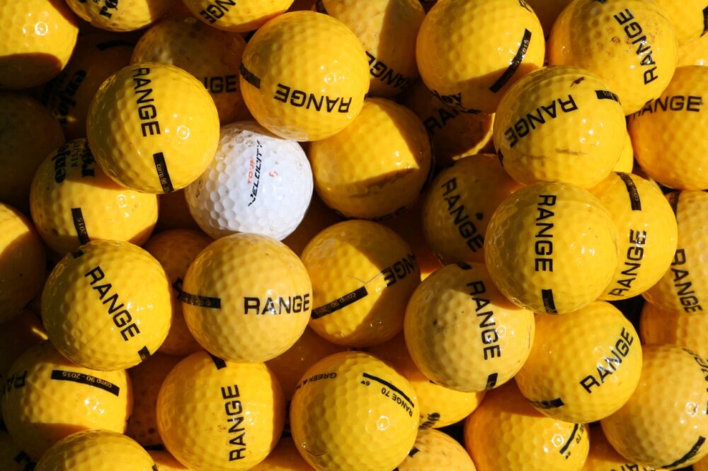 many-yellow-golf-balls